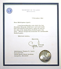 the coin that JFK was to toss 50 yrs ago